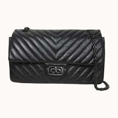 Bolsa Chanel Classic Flap Reissue 2.55